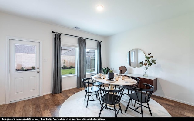 dining room with hardwood / wood-style flooring