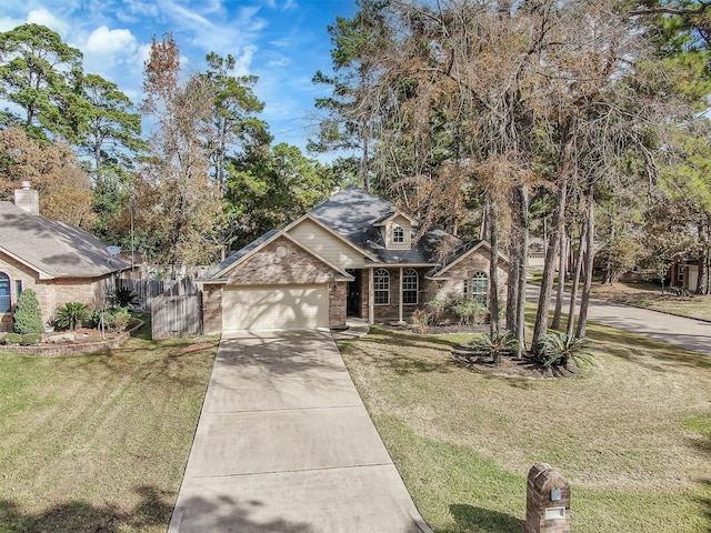 view of front facade featuring a garage and a front yard