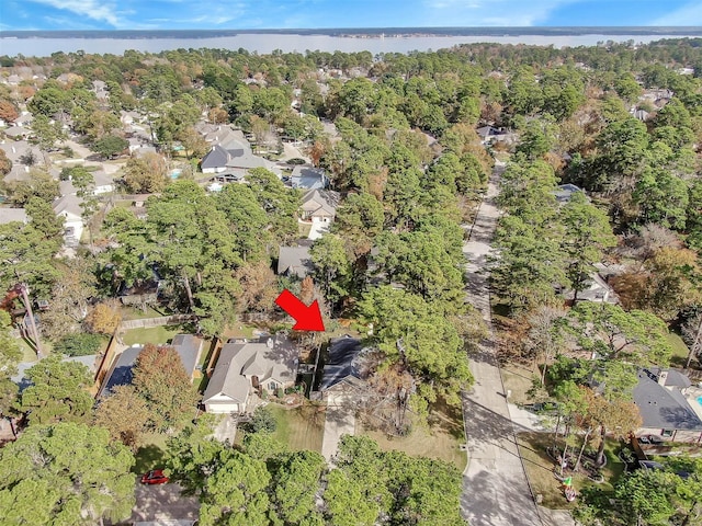 birds eye view of property with a residential view and a forest view