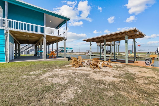 exterior space with a boat dock and a water view