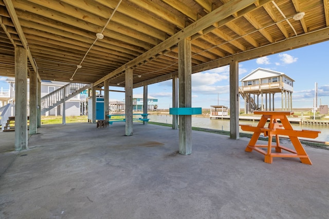 view of patio with a water view