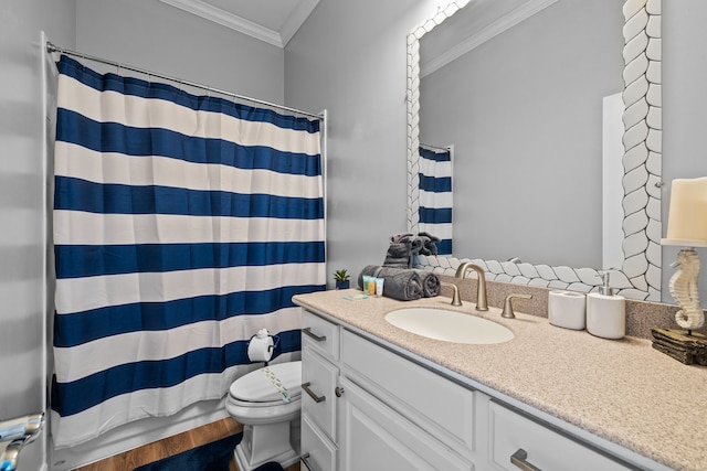 bathroom with a shower with shower curtain, ornamental molding, vanity, wood-type flooring, and toilet