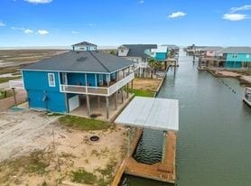 rear view of property featuring a water view