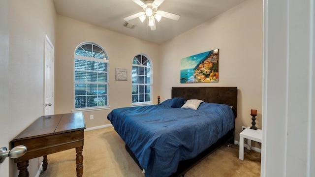 bedroom featuring light colored carpet and ceiling fan