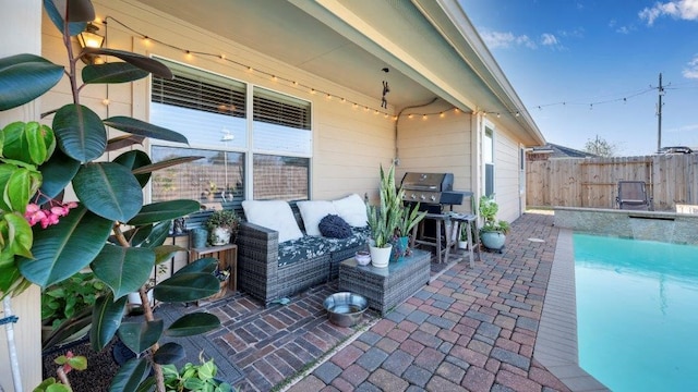 view of patio featuring area for grilling, a fenced in pool, and outdoor lounge area