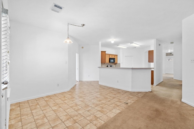 unfurnished living room with light carpet