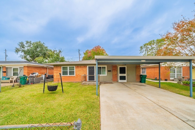 single story home featuring a carport and a front yard