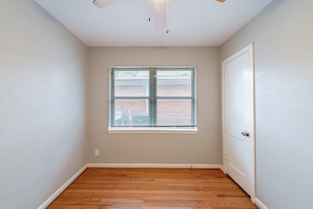 spare room with ceiling fan and light hardwood / wood-style flooring