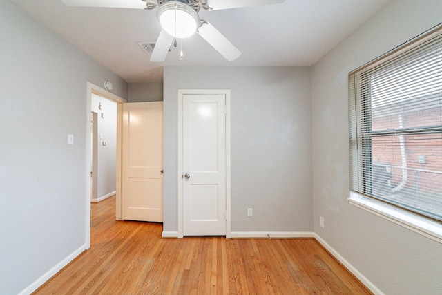 unfurnished bedroom featuring ceiling fan and light hardwood / wood-style floors