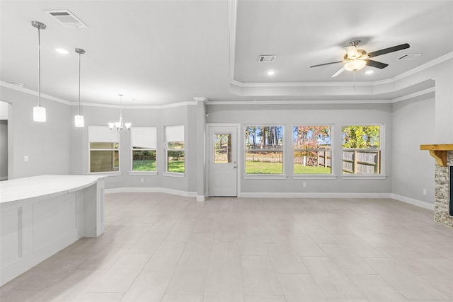 unfurnished living room featuring a fireplace, light tile patterned floors, ceiling fan with notable chandelier, and ornamental molding