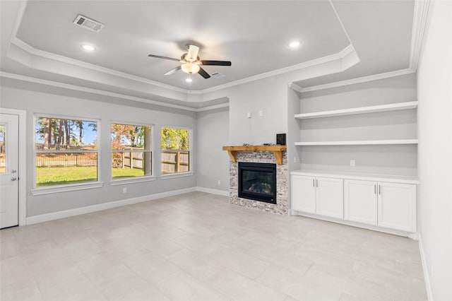 unfurnished living room with crown molding, a fireplace, and ceiling fan