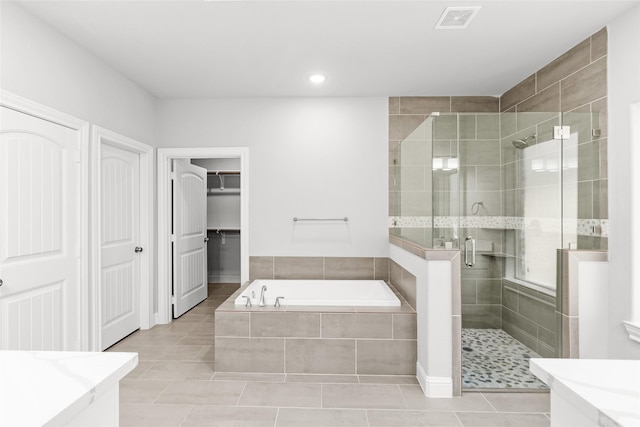 bathroom featuring vanity, tile patterned floors, and independent shower and bath