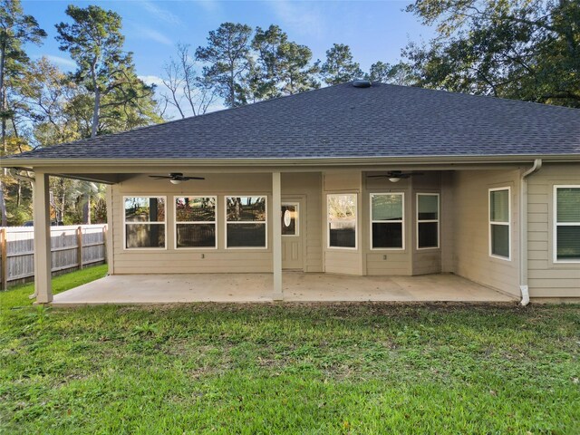 back of house with a lawn, a patio area, and ceiling fan