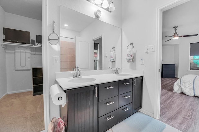 bathroom featuring hardwood / wood-style floors, vanity, and ceiling fan