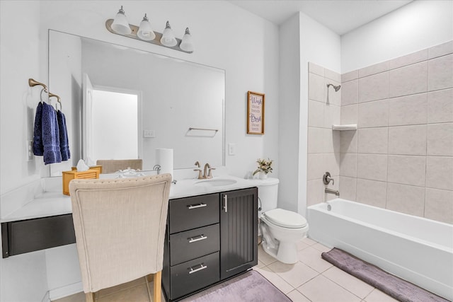 full bathroom featuring tile patterned floors, vanity, tiled shower / bath combo, and toilet