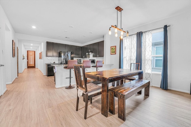 dining space with light hardwood / wood-style floors