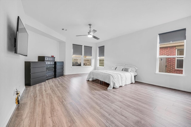 bedroom featuring light hardwood / wood-style floors and ceiling fan