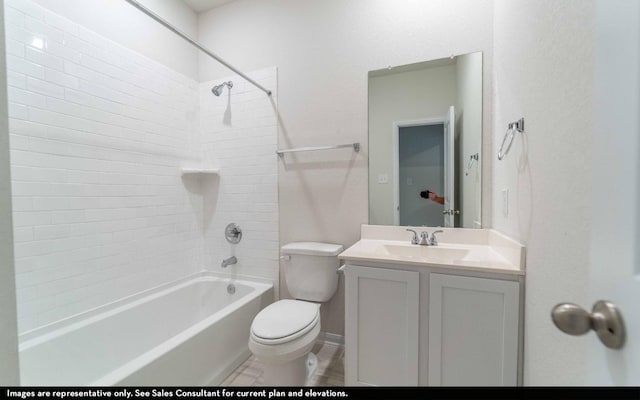 full bathroom with vanity, toilet, and tiled shower / bath