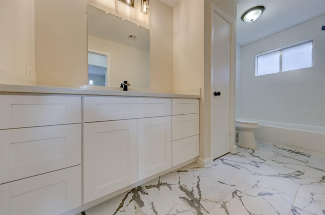 full bathroom featuring shower / bathing tub combination, vanity, and toilet