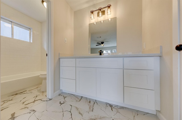 full bathroom featuring vanity, shower / bath combination, toilet, and ceiling fan