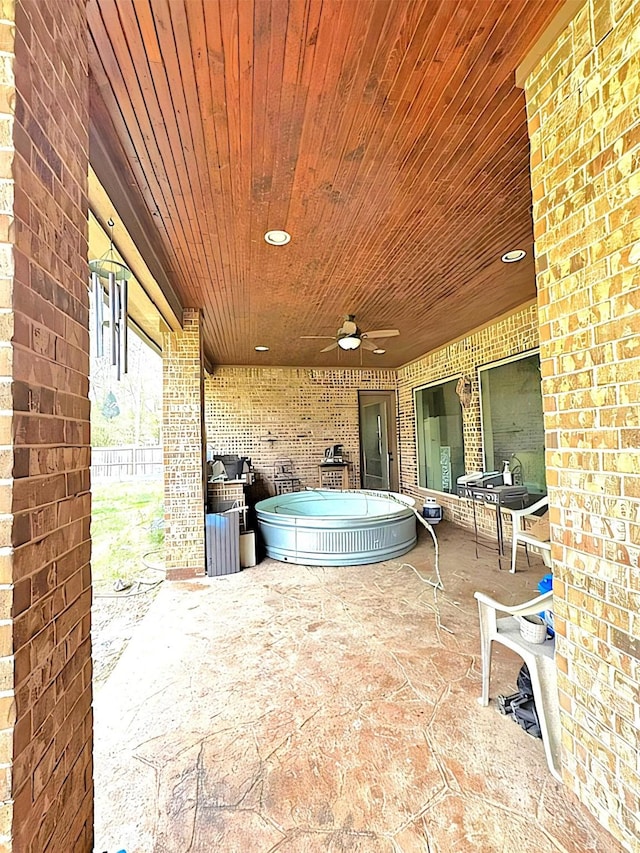 view of patio featuring ceiling fan