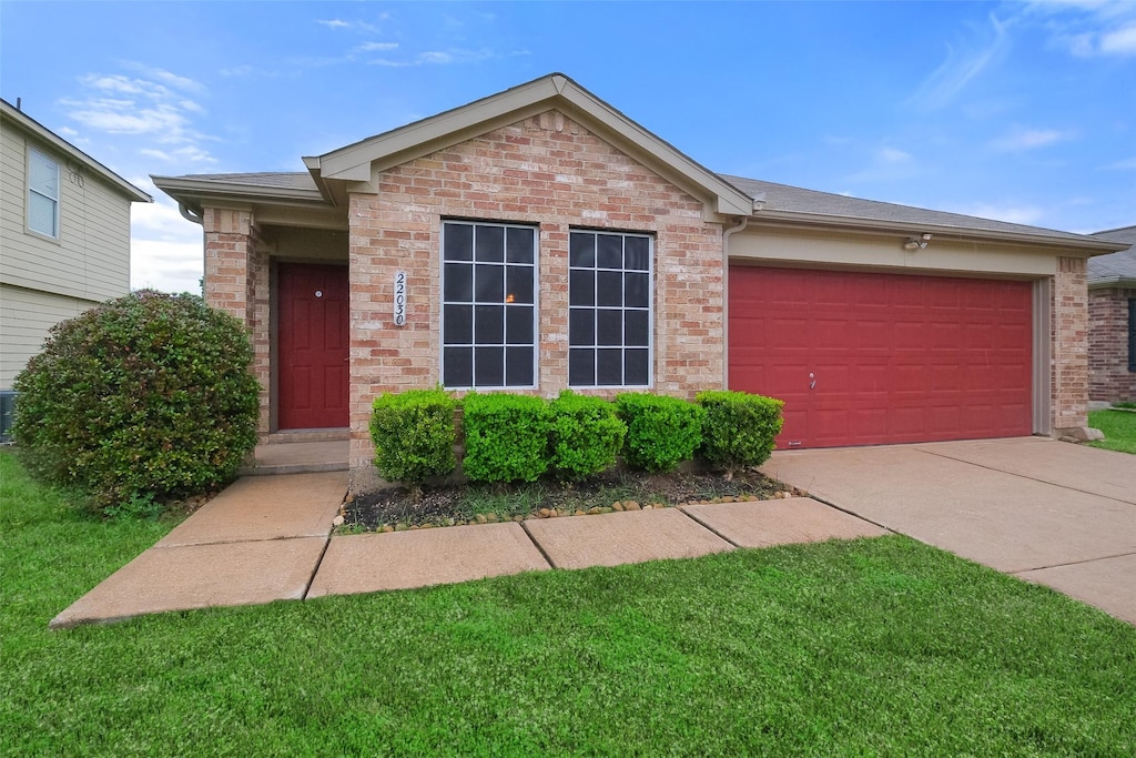 ranch-style house featuring a garage