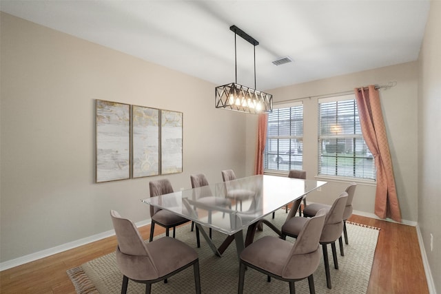 dining space with light wood-type flooring