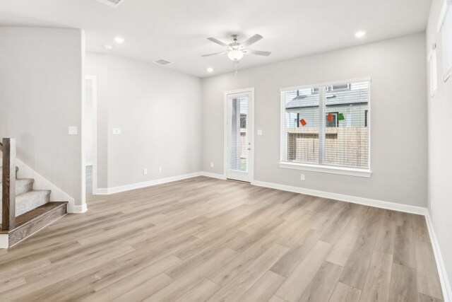 spare room featuring light hardwood / wood-style flooring and ceiling fan