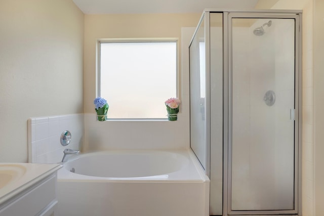 bathroom with plus walk in shower and vanity