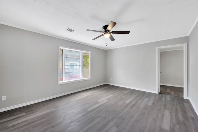 unfurnished room with crown molding, ceiling fan, and hardwood / wood-style flooring