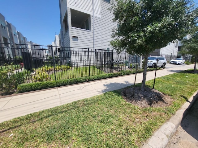 view of property exterior featuring a lawn