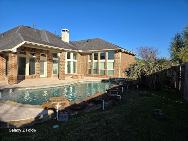 view of swimming pool featuring a patio area and ceiling fan