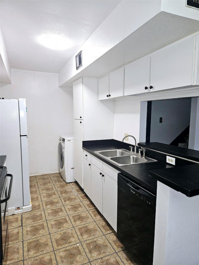 kitchen featuring white cabinetry, dishwasher, sink, separate washer and dryer, and range