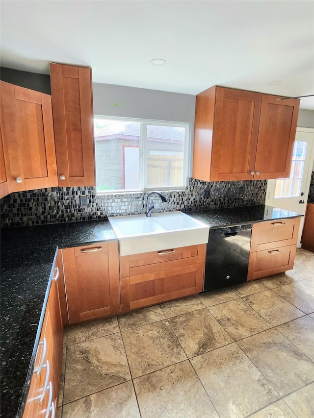 kitchen with decorative backsplash, dishwasher, and sink