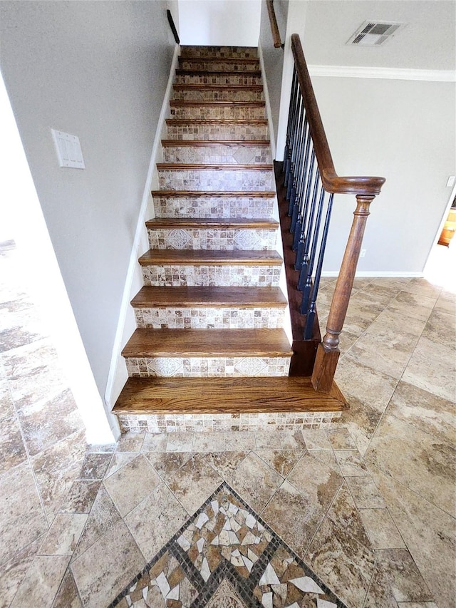 staircase with crown molding