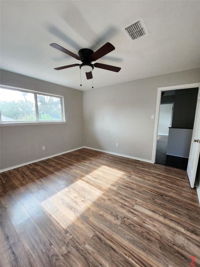 spare room featuring ceiling fan and wood-type flooring