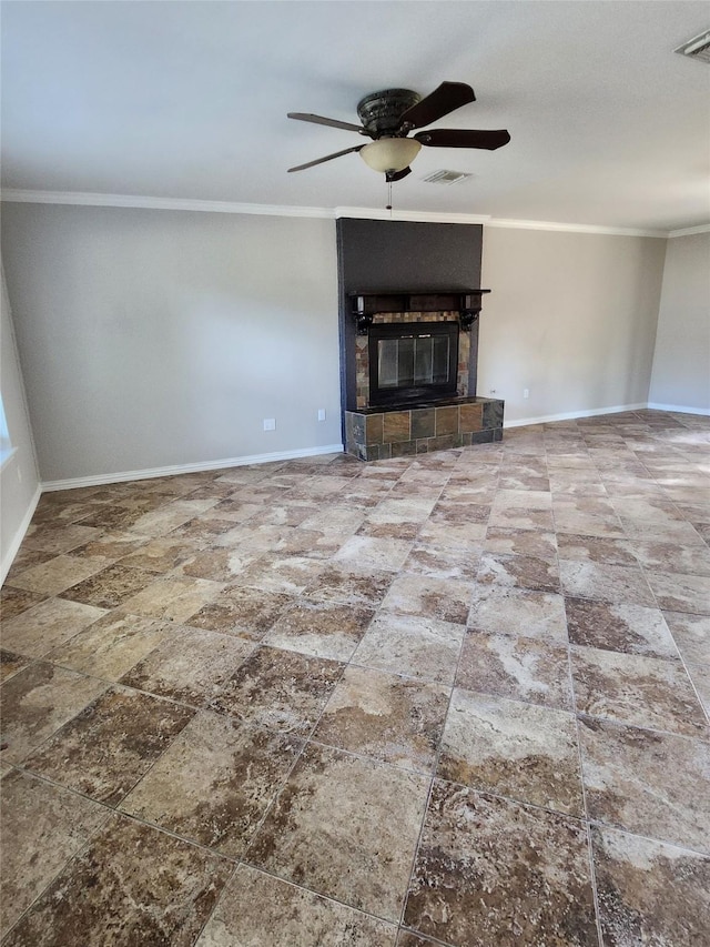 unfurnished living room featuring ceiling fan, ornamental molding, and a tiled fireplace