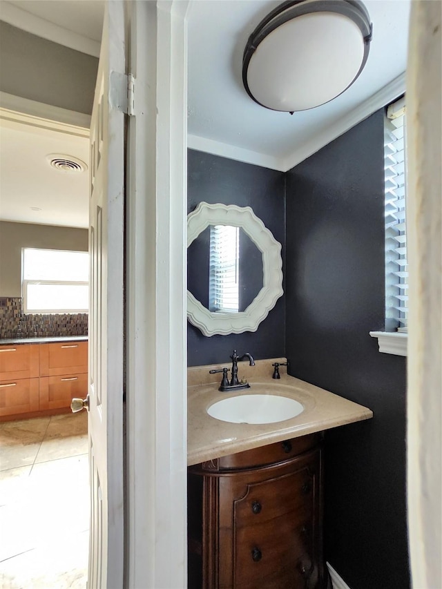 bathroom featuring tile patterned flooring and vanity