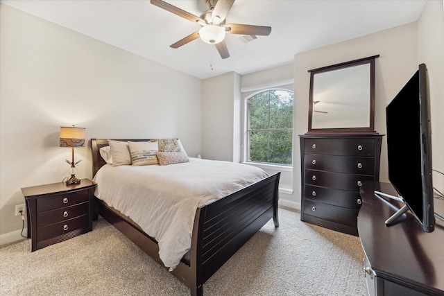 bedroom with ceiling fan and light colored carpet