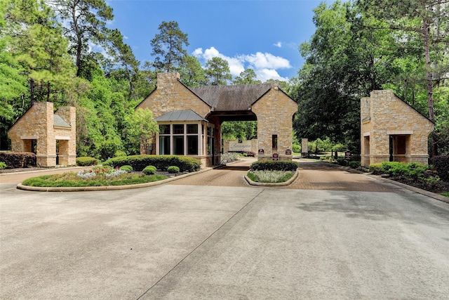 view of front of home with a sunroom