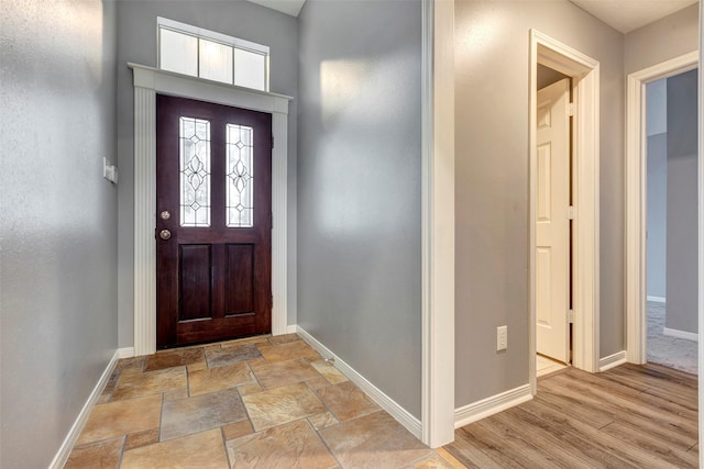 foyer entrance with light hardwood / wood-style floors