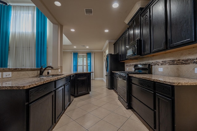 kitchen with sink, decorative backsplash, light tile patterned floors, black appliances, and ornamental molding