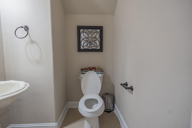 bathroom featuring tile patterned floors and toilet