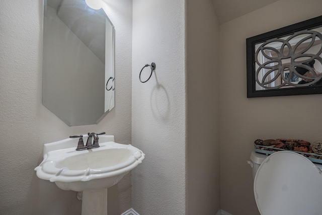 bathroom with sink and toilet