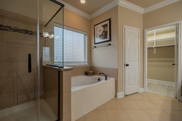 bathroom featuring tile patterned floors, crown molding, and independent shower and bath