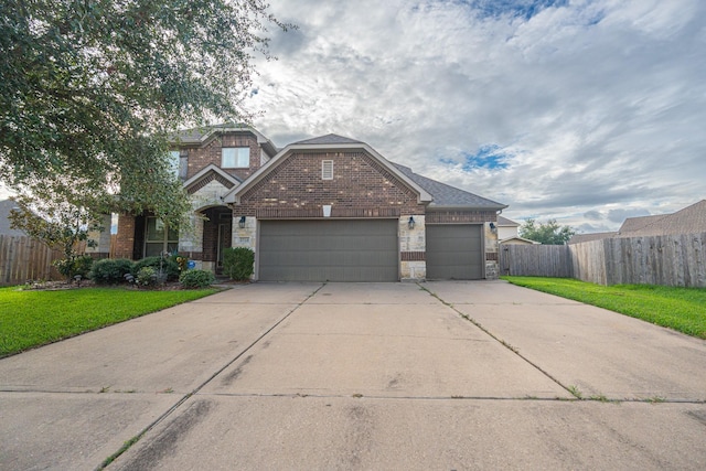 view of front of home with a garage and a front yard