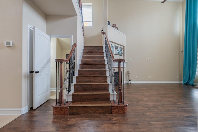 stairs featuring hardwood / wood-style flooring