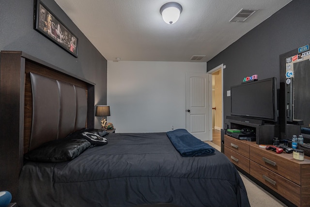 bedroom with light colored carpet