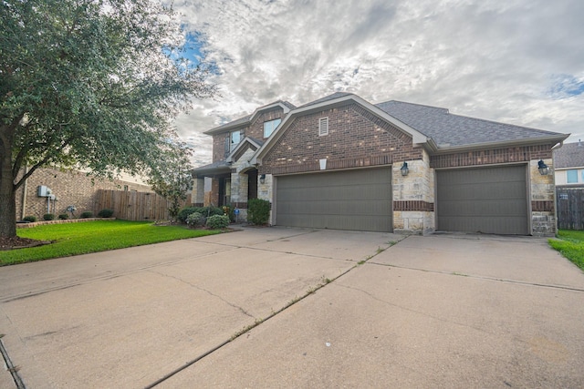 view of front of home featuring a garage and a front lawn