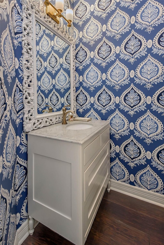 bathroom with vanity and hardwood / wood-style flooring